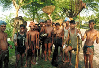 Fishers showing their catch after a morning of fishing (Tangail district, Bangladesh).