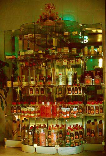 Two attractive displays of various cosmetic items, all containing one or more primary bee products (left: Müngersdorff, Germany; right: La casa de miel Argentina).