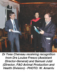 Dr Yves Cheneau receiving recognition from Drs Louise Fresco (Assistant Director-General) and Samuel Jutzi (Director, FAO Animal Production and Health Division) - PHOTO: W. Amanfu